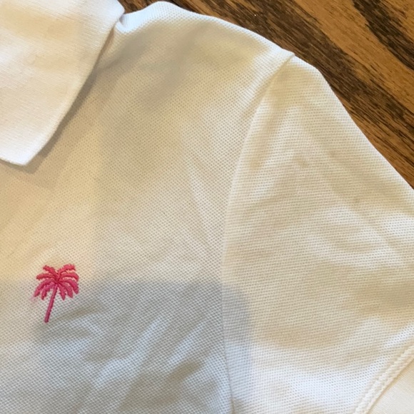 White Women’s Polo Shirt with Pink Logo - Picture 3 of 3